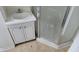 A bathroom with a modern sink and vanity adjacent to a glass shower stall at 1018 Jefferson Ave, Indianapolis, IN 46201