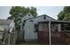 Home exterior featuring a covered porch and side entrance at 1018 Jefferson Ave, Indianapolis, IN 46201
