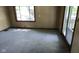 Cozy living room with a window view and a door leading to an outdoor space at 1018 Jefferson Ave, Indianapolis, IN 46201