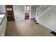 Inviting living area with hardwood floors, staircase, and hallways to kitchen and bathroom at 1018 Jefferson Ave, Indianapolis, IN 46201