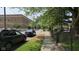 Street view showcasing the neighborhood and parked cars at 1018 Jefferson Ave, Indianapolis, IN 46201