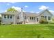 Spacious backyard features a well-maintained lawn and mature landscaping at 1051 Arrowwood Dr, Carmel, IN 46033