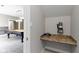 Basement area features a built-in desk and vintage-style telephone at 1051 Arrowwood Dr, Carmel, IN 46033