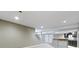 Spacious basement features a bar area, stairs, and neutral carpeting at 1051 Arrowwood Dr, Carmel, IN 46033