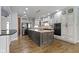 Modern kitchen with large center island, stainless appliances, and stylish cabinetry at 1051 Arrowwood Dr, Carmel, IN 46033