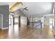 Spacious living room with vaulted ceilings, wooden beams, and hardwood floors at 1051 Arrowwood Dr, Carmel, IN 46033