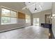 Bright sunroom with tile floors, vaulted ceilings, many windows, and access to backyard at 1051 Arrowwood Dr, Carmel, IN 46033