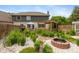 Landscaped backyard features a fire pit, pergola covered deck, and lush greenery at 1120 Mill Run Overlook, Noblesville, IN 46062