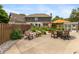 Backyard concrete patio with outdoor seating, an umbrella and a cozy fire pit at 1120 Mill Run Overlook, Noblesville, IN 46062