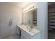 Elegant bathroom with marble countertop, vanity, and walk-in closet with shelving at 1120 Mill Run Overlook, Noblesville, IN 46062