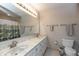 Bathroom vanity featuring double sinks, a large mirror, and brushed nickel faucets at 1120 Mill Run Overlook, Noblesville, IN 46062