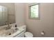Cozy bathroom with a sink, toilet, and window, creating a bright and practical space at 1120 Mill Run Overlook, Noblesville, IN 46062