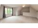 Bright bedroom features a large window, soft carpet, and a ceiling fan at 1120 Mill Run Overlook, Noblesville, IN 46062