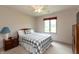 Bedroom featuring a ceiling fan and full sized bed with a grey and white plaid comforter at 1120 Mill Run Overlook, Noblesville, IN 46062