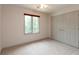 Spacious bedroom featuring a window, closet, ceiling fan, and neutral carpet at 1120 Mill Run Overlook, Noblesville, IN 46062