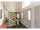Bright entryway with hardwood floors, staircase, and large front doors at 1120 Mill Run Overlook, Noblesville, IN 46062