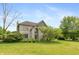Charming two-story home with a brick facade, lush lawn and mature trees at 1120 Mill Run Overlook, Noblesville, IN 46062