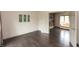 Bedroom with hardwood floors opening up to a living room with built-in shelves at 1120 Mill Run Overlook, Noblesville, IN 46062