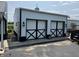 White barn with black trim and black 'X' designs on the garage doors at 115 W State Road 38, Pendleton, IN 46064