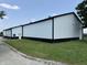 Large white and black barn with a side door and expansive lawn at 115 W State Road 38, Pendleton, IN 46064