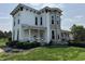 Beautiful two-story home with stone accents and well-manicured landscaping at 115 W State Road 38, Pendleton, IN 46064
