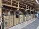 Interior view of horse stalls, wood construction, with metal bars and fixtures at 115 W State Road 38, Pendleton, IN 46064