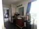Bathroom with a sink, mirror, wood cabinets and a bright window at 12509 Teacup Way, Indianapolis, IN 46235