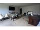 A spacious carpeted bedroom featuring a TV, dresser and mirror, as well as two lamps at 12509 Teacup Way, Indianapolis, IN 46235
