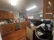 A cozy kitchen equipped with wood cabinets, modern appliances, and ample counter space at 12509 Teacup Way, Indianapolis, IN 46235