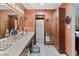 Large bathroom with dual vanity, a large mirror, and a separate closet at 13153 Tudor Dr, Carmel, IN 46033