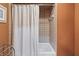 Tiled shower with shower curtain at 13153 Tudor Dr, Carmel, IN 46033