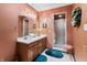 Bathroom with shower, double sink vanity, updated lighting and decor at 13153 Tudor Dr, Carmel, IN 46033