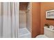 Tiled shower with shower curtain and matching decor at 13153 Tudor Dr, Carmel, IN 46033