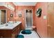 Bathroom with shower, double sink vanity, updated lighting and cute decor at 13153 Tudor Dr, Carmel, IN 46033