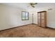 Bedroom featuring carpet, ceiling fan, baseboard trim, and bright natural light at 13153 Tudor Dr, Carmel, IN 46033