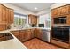 Functional kitchen with stainless steel appliances and tile flooring at 13153 Tudor Dr, Carmel, IN 46033
