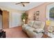 Living room featuring a comfortable white couch, complemented by stylish decor and natural light at 13153 Tudor Dr, Carmel, IN 46033