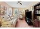 Inviting living room featuring plush white couch, recliner, and dark wood bookcase for a cozy retreat at 13153 Tudor Dr, Carmel, IN 46033