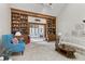 Bright living room featuring built-in shelving and lots of natural light at 13153 Tudor Dr, Carmel, IN 46033