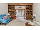 Charming living room features custom wood bookshelves and plush seating at 13153 Tudor Dr, Carmel, IN 46033