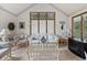 Bright sun room with vaulted ceiling and wicker furniture at 13153 Tudor Dr, Carmel, IN 46033