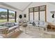 Inviting sun room with abundant natural light and comfortable wicker seating at 13153 Tudor Dr, Carmel, IN 46033
