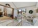 Brightly lit sun room with comfortable seating area and view to the outside at 13153 Tudor Dr, Carmel, IN 46033