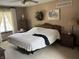 Relaxing bedroom with warm tones, ceiling fan and ample space at 13736 Langley Dr, Carmel, IN 46032