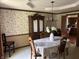 Traditional dining room with a chandelier and a decorative china cabinet at 13736 Langley Dr, Carmel, IN 46032
