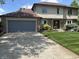 A view of the house and driveway with a well-manicured lawn and an attached two-car garage at 13736 Langley Dr, Carmel, IN 46032