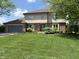 Traditional two-story home with a well-maintained lawn and an attached two-car garage at 13736 Langley Dr, Carmel, IN 46032