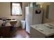 Practical laundry room equipped with a washer, dryer, and ample storage space at 13736 Langley Dr, Carmel, IN 46032