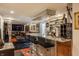 Basement featuring a bar, seating and living area with TV and entertainment at 1437 Shannon Ave, Indianapolis, IN 46201
