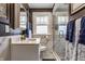 Beautiful bathroom with marble countertop, tiled walk-in shower, and stylish finishes at 1437 Shannon Ave, Indianapolis, IN 46201